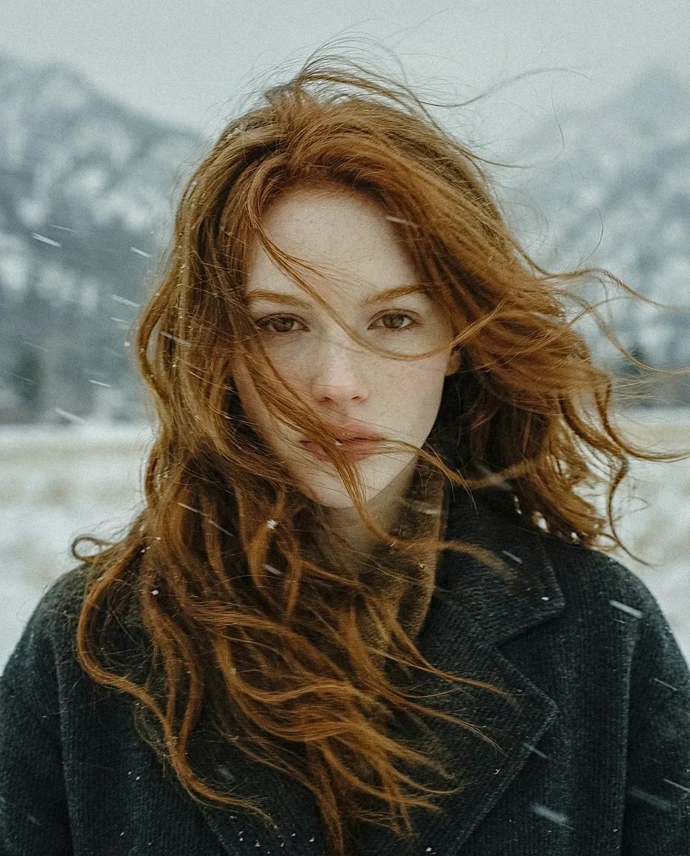 Cinematic Portrait of Young Woman in Snowy Landscape thumbnail 2