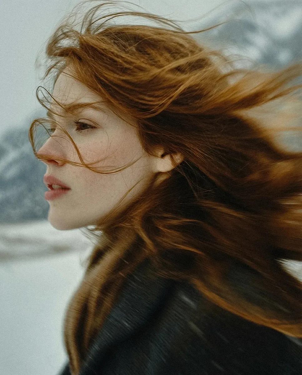 Cinematic Portrait of Young Woman in Snowy Landscape thumbnail 3