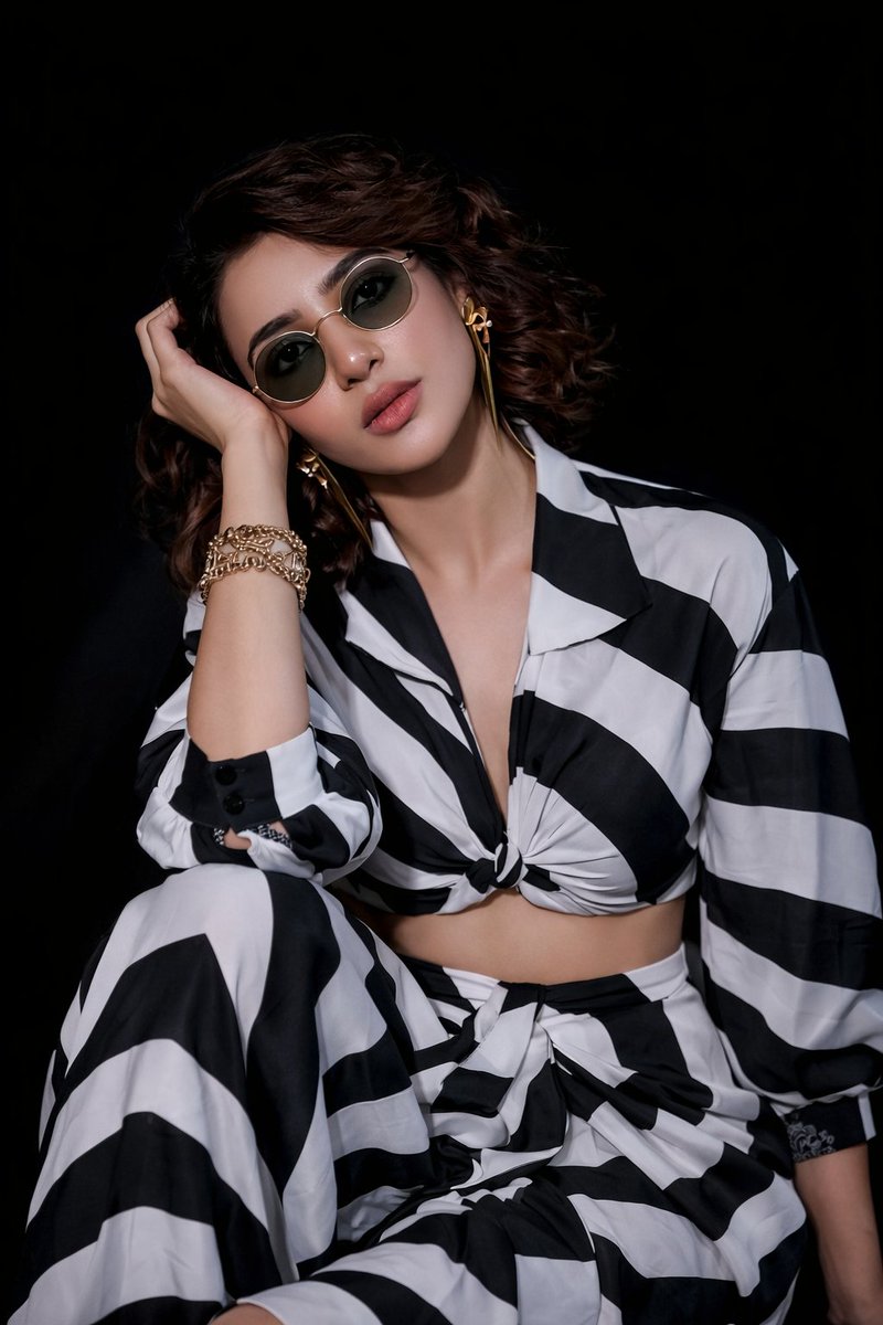 Modern Studio Fashion Editorial Portrait with Striped Outfit thumbnail 2