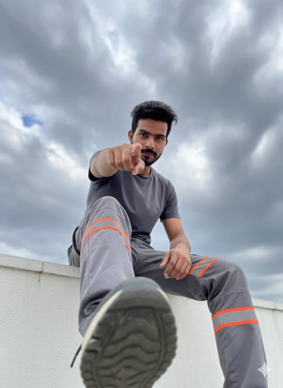 Dynamic Low-Angle Portrait of a Confident Young Man - view 1
